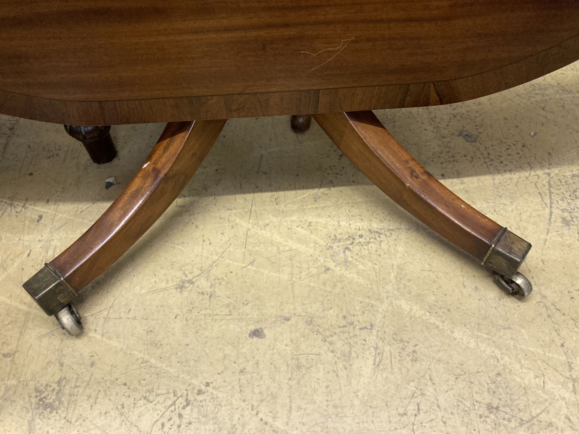 A George IV rosewood banded mahogany tilt top breakfast table, width 117cm, depth 117cm, height 69cm